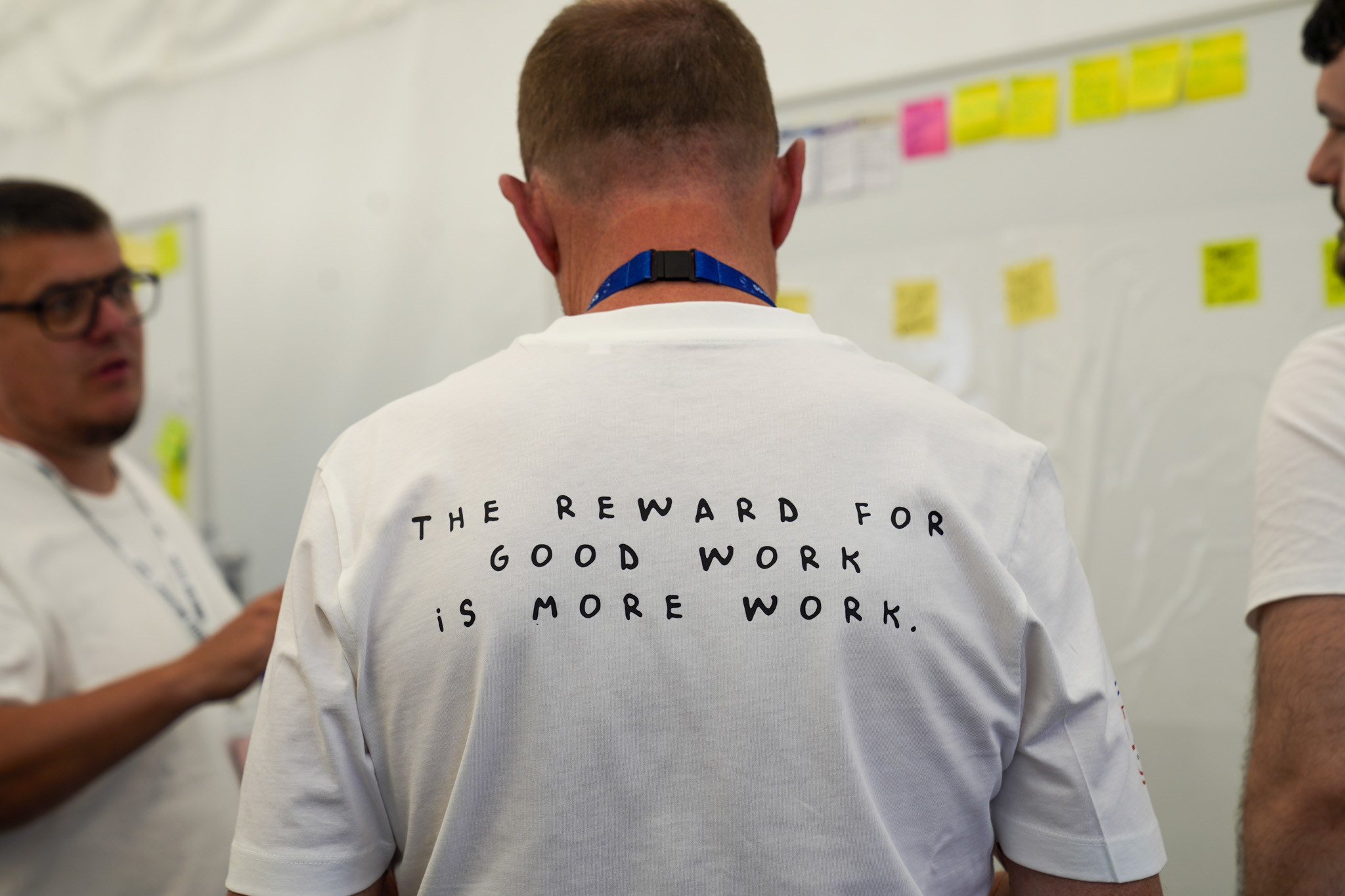 Innovation Festival 2026 - delegates around a white board with sticky notes